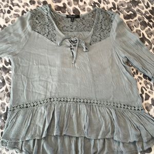 Woman teal coke red blouse. Size M